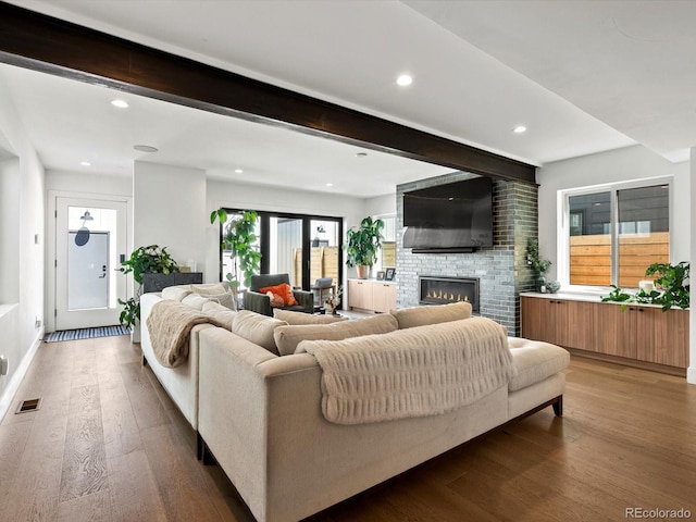 1612 Wolff St, Denver, CO 80204 - living room with beam ceiling, wood finished floors, recessed lighting, and a fireplace