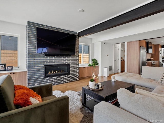1612 Wolff St, Denver, CO 80204 - living room with wood finished floors, a tile fireplace, and recessed lighting