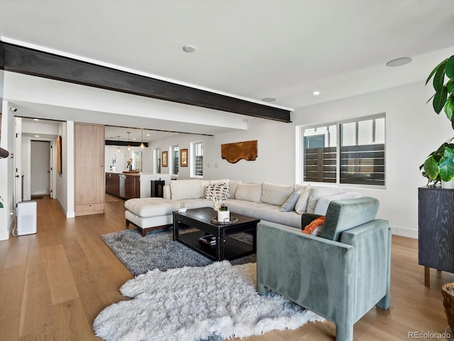 1612 Wolff St, Denver, CO 80204 - living area with wood finished floors, beamed ceiling, and recessed lighting