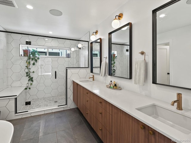 1612 Wolff St, Denver, CO 80204 - bathroom featuring double vanity, a shower stall, tile patterned floors, and recessed lighting