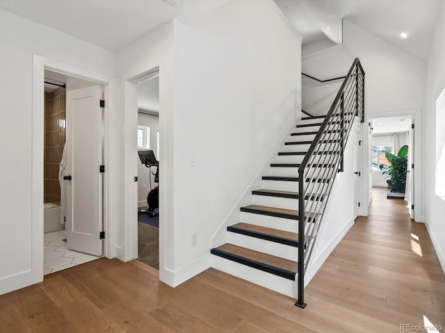 1612 Wolff St, Denver, CO 80204 - staircase with wood finished floors, healthy amount of natural light, and recessed lighting