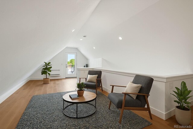 1612 Wolff St, Denver, CO 80204 - living area with vaulted ceiling, wood finished floors, and recessed lighting
