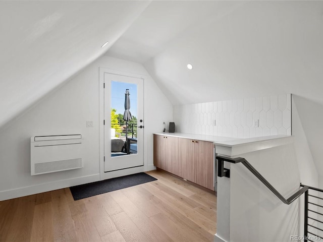 1612 Wolff St, Denver, CO 80204 - additional living space featuring light wood-style floors, lofted ceiling, heating unit, and recessed lighting