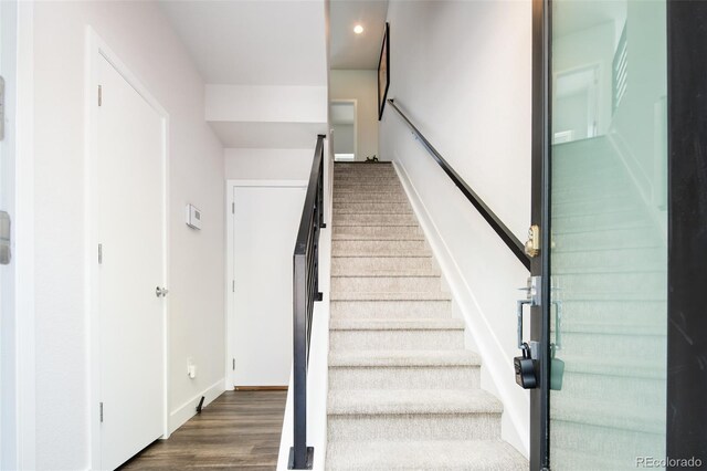 5630 W 11th Pl, Lakewood, CO 80214 - stairs with baseboards, wood finished floors, and recessed lighting