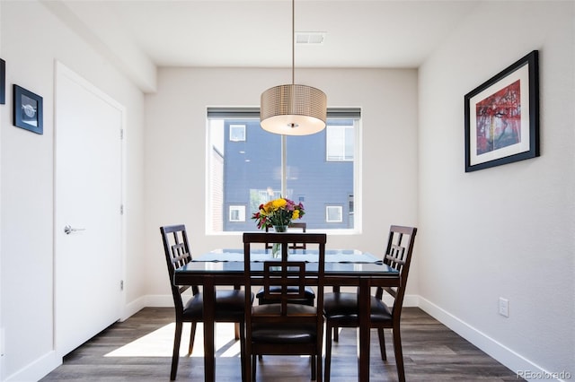 5630 W 11th Pl, Lakewood, CO 80214 - dining space featuring dark wood-type flooring and baseboards