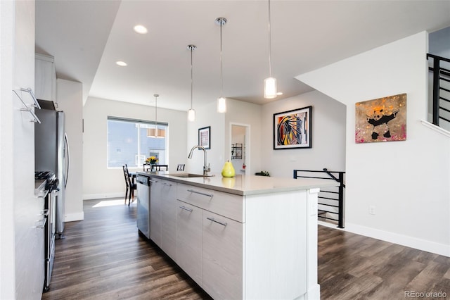 5630 W 11th Pl, Lakewood, CO 80214 - kitchen with dark wood-type flooring, an island with sink, recessed lighting, modern cabinets, and baseboards