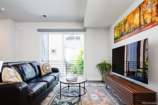 5630 W 11th Pl, Lakewood, CO 80214 - living room featuring wood finished floors and baseboards