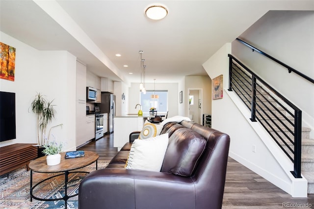 5630 W 11th Pl, Lakewood, CO 80214 - living room with dark wood-type flooring, stairs, baseboards, and recessed lighting
