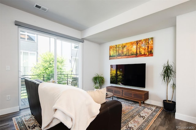 5630 W 11th Pl, Lakewood, CO 80214 - living area with baseboards and dark wood-style floors