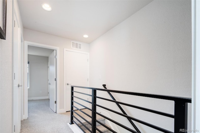 5630 W 11th Pl, Lakewood, CO 80214 - corridor featuring an upstairs landing, light colored carpet, baseboards, and recessed lighting