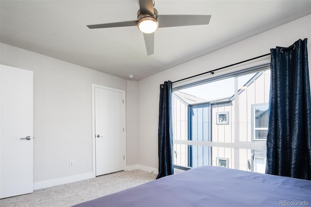 5630 W 11th Pl, Lakewood, CO 80214 - carpeted bedroom with baseboards and ceiling fan