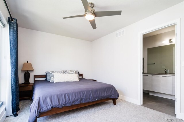 5630 W 11th Pl, Lakewood, CO 80214 - bedroom featuring ensuite bath, carpet, baseboards, ceiling fan, and a sink