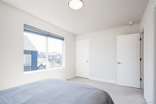5630 W 11th Pl, Lakewood, CO 80214 - carpeted bedroom featuring baseboards