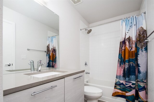 5630 W 11th Pl, Lakewood, CO 80214 - bathroom featuring vanity, toilet, and shower / tub combo with curtain