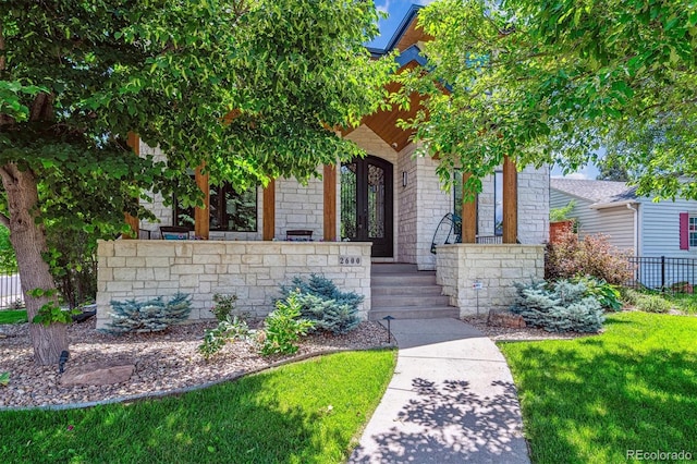 2600 S Adams St, Denver, CO 80210 - view of property hidden behind natural elements featuring covered porch