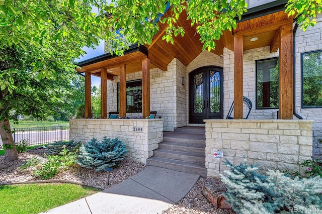 2600 S Adams St, Denver, CO 80210 - view of exterior entry featuring stone siding and covered porch
