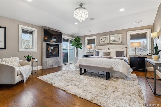 2600 S Adams St, Denver, CO 80210 - bedroom featuring access to exterior, wood finished floors, a chandelier, and recessed lighting