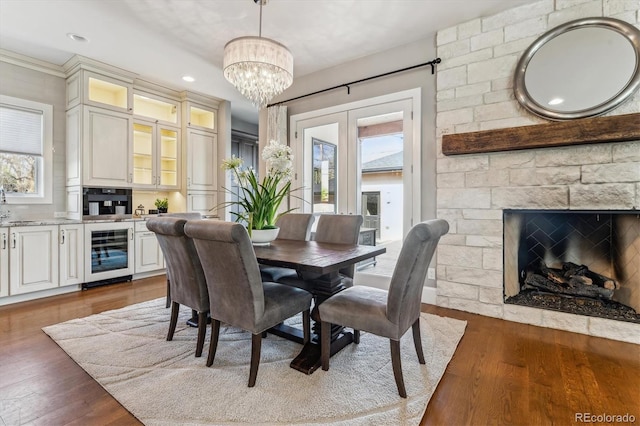2600 S Adams St, Denver, CO 80210 - dining space with beverage cooler, healthy amount of natural light, a chandelier, dark wood-style flooring, and recessed lighting