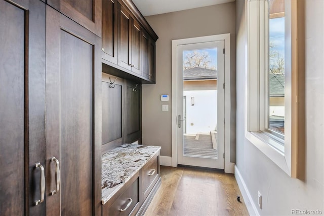 2600 S Adams St, Denver, CO 80210 - mudroom featuring light wood-style floors and baseboards