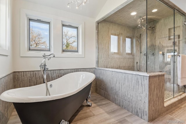 2600 S Adams St, Denver, CO 80210 - full bath with a soaking tub, wainscoting, a shower stall, and recessed lighting