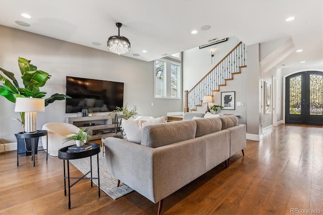 2600 S Adams St, Denver, CO 80210 - living room with plenty of natural light, stairway, hardwood / wood-style floors, recessed lighting, and french doors
