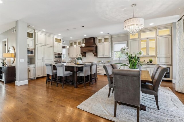 2600 S Adams St, Denver, CO 80210 - dining space with a chandelier, dark wood-style flooring, and recessed lighting
