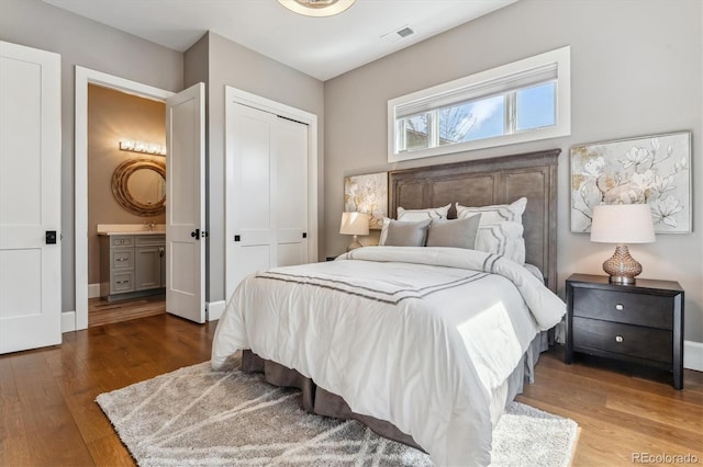 2600 S Adams St, Denver, CO 80210 - bedroom with wood finished floors and a closet