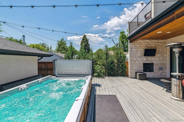 2600 S Adams St, Denver, CO 80210 - wooden deck with an outdoor stone fireplace