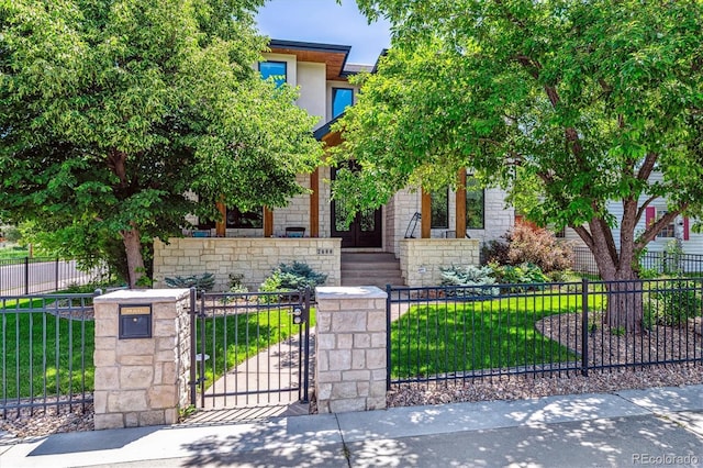 2600 S Adams St, Denver, CO 80210 - view of property hidden behind natural elements featuring a fenced front yard and a gate