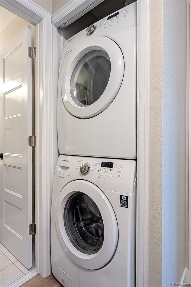 8378 S Upham Way Unit B305, Littleton, CO 80128 - laundry room featuring stacked washer / drying machine