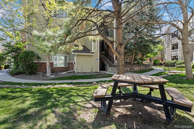 8378 S Upham Way Unit B305, Littleton, CO 80128 - surrounding community with a yard