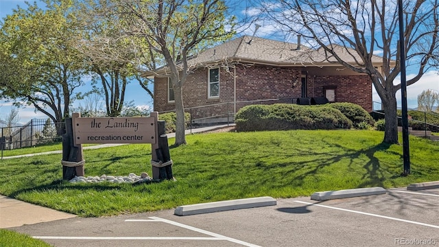 8378 S Upham Way Unit B305, Littleton, CO 80128 - view of property exterior featuring brick siding and uncovered parking