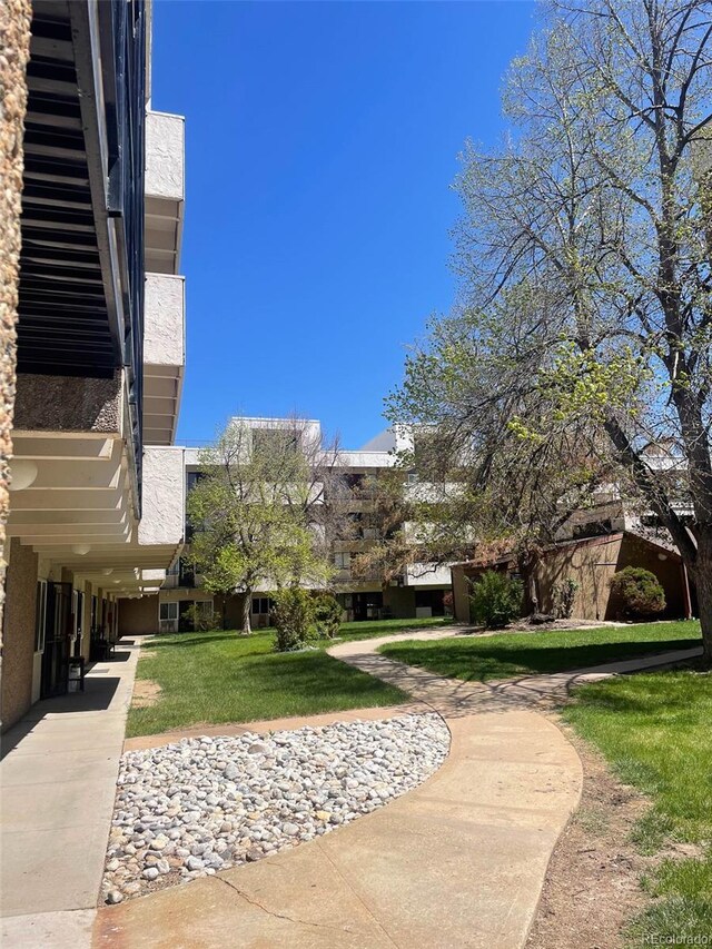 view of home's community featuring a lawn