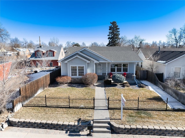 single story home featuring a front lawn