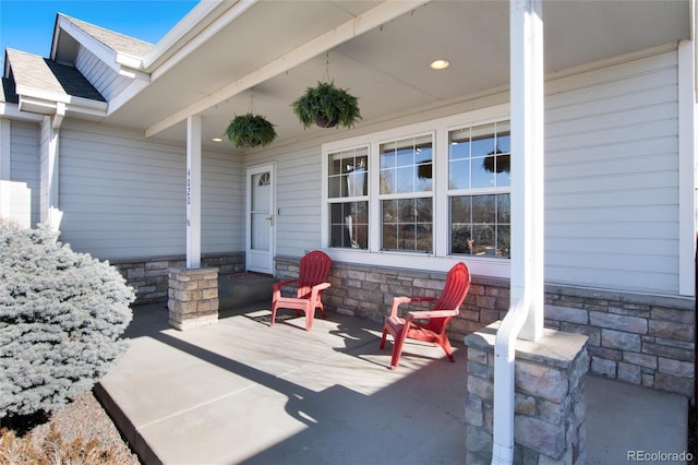 view of patio featuring a porch