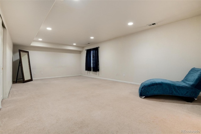 living area featuring light colored carpet