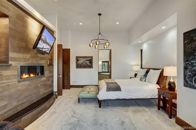 bedroom with carpet flooring and a notable chandelier