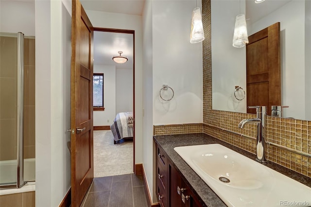 bathroom featuring vanity and decorative backsplash