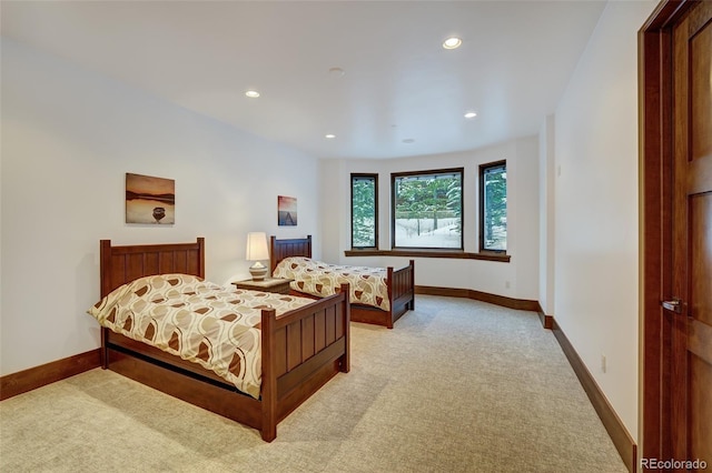 bedroom featuring light colored carpet