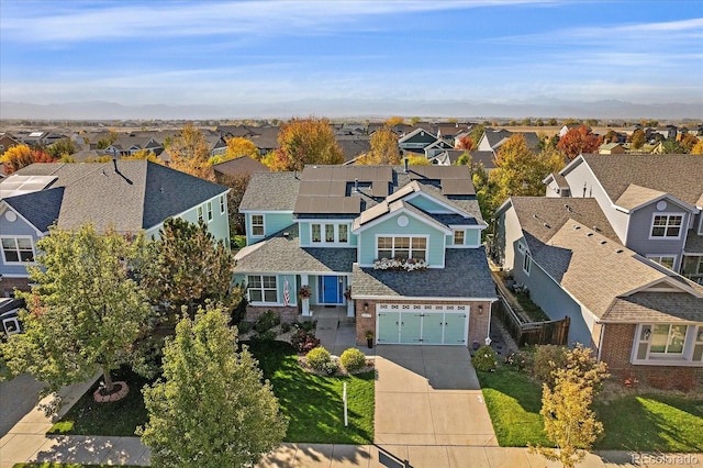 6317 Ruby Hill Dr, Erie, CO 80516 - view of front of house with a residential view, a garage, driveway, and brick siding