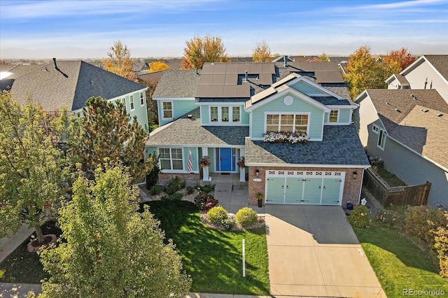 6317 Ruby Hill Dr, Erie, CO 80516 - shingle-style home with roof with shingles, concrete driveway, and a residential view