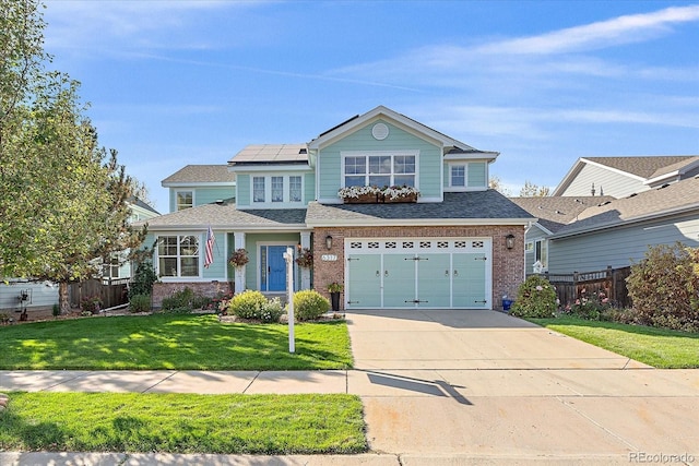 6317 Ruby Hill Dr, Erie, CO 80516 - view of front of home featuring brick siding, roof mounted solar panels, fence, and concrete driveway