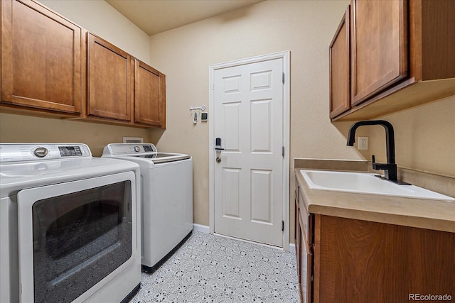 6317 Ruby Hill Dr, Erie, CO 80516 - washroom with cabinet space, baseboards, a sink, and washer and dryer