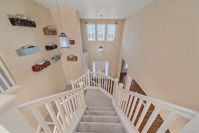 6317 Ruby Hill Dr, Erie, CO 80516 - staircase featuring a high ceiling