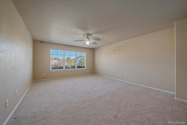 6317 Ruby Hill Dr, Erie, CO 80516 - carpeted spare room featuring a textured ceiling, ceiling fan, and baseboards
