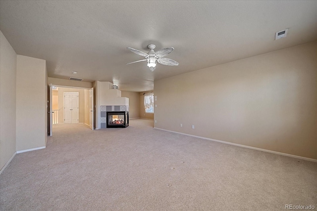 6317 Ruby Hill Dr, Erie, CO 80516 - unfurnished living room with ceiling fan, light carpet, baseboards, and a fireplace
