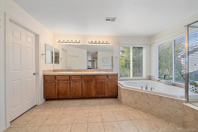 6317 Ruby Hill Dr, Erie, CO 80516 - bathroom with double vanity, visible vents, a sink, and a bath