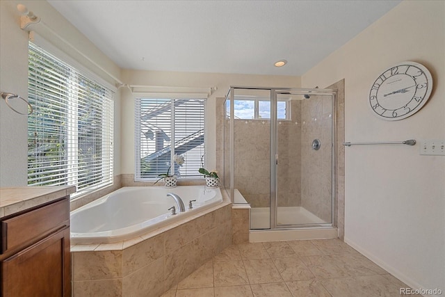 6317 Ruby Hill Dr, Erie, CO 80516 - full bath with tile patterned floors, a bath, a wealth of natural light, and a shower stall