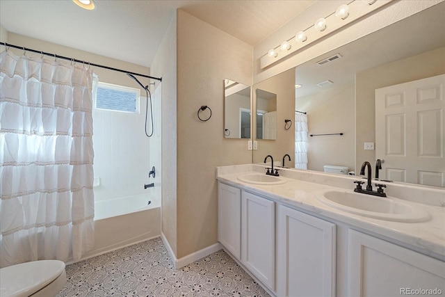 6317 Ruby Hill Dr, Erie, CO 80516 - full bath with visible vents, speckled floor, a sink, baseboards, and toilet