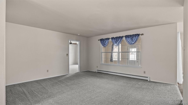 carpeted spare room with ceiling fan, baseboard heating, and baseboards